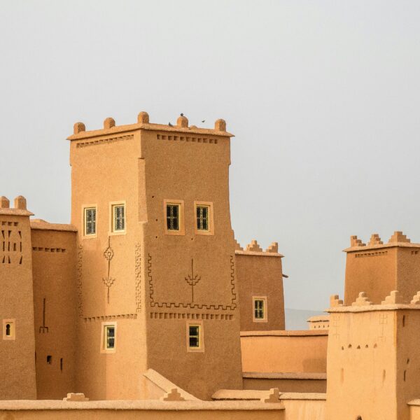 Traditional earthen architecture with towers, showcasing historical fortifications.